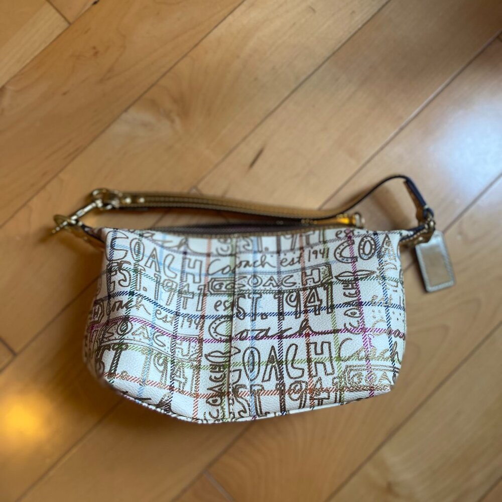 COACH purse limited design; gold embellishments; pink lining